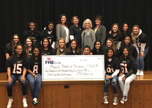 Mayfield High School Cheerleaders with third quarter spirit debit card check